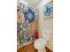 A full bathroom featuring a toilet and a floral shower curtain at 1152 S Yosemite Way # 29, Denver, CO 80247