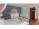 A cheerfully decorated bedroom with wood floors features a wallpapered accent wall and access to an ensuite bathroom at 1152 S Yosemite Way # 29, Denver, CO 80247