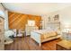 Well decorated bedroom with wood floors, colorful art, and light-colored furniture at 1152 S Yosemite Way # 29, Denver, CO 80247