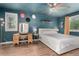 Spacious bedroom featuring wood-look floors, blue walls and ceiling, and bright windows at 1152 S Yosemite Way # 29, Denver, CO 80247