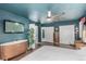 Large bedroom features blue walls and ceiling, a ceiling fan, and wood-look flooring at 1152 S Yosemite Way # 29, Denver, CO 80247