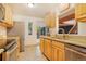 Updated kitchen featuring granite countertops and stainless steel appliances, connecting to patio at 1152 S Yosemite Way # 29, Denver, CO 80247