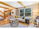 Bright living room with hardwood floors, neutral sofa, and a view to the dining area at 1152 S Yosemite Way # 29, Denver, CO 80247