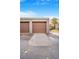 Parking garage with numbered spaces and brown garage doors, perfect for storage and parking at 1152 S Yosemite Way # 29, Denver, CO 80247