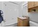 Bathroom featuring a vanity, medicine cabinet, toilet, and a shower/tub combo with tiled walls at 2500 S York St # 310, Denver, CO 80210