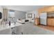 Bright, open living space featuring a bed, a dining area, and efficient kitchen with stainless steel appliances at 2500 S York St # 310, Denver, CO 80210