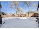 Large backyard with a snow covered lawn at 4745 S Sherman St, Englewood, CO 80113