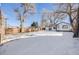 Large backyard with a snow covered lawn at 4745 S Sherman St, Englewood, CO 80113