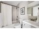 Bright bathroom featuring a shower-over-tub combination, modern vanity, and stylish wall decor at 4745 S Sherman St, Englewood, CO 80113