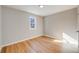 Bright bedroom features hardwood floors and neutral walls at 4745 S Sherman St, Englewood, CO 80113