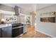 Modern kitchen featuring quartz countertops and stainless steel appliances opening to the living room at 4745 S Sherman St, Englewood, CO 80113