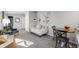 Comfortable living room featuring plush seating, carpet, and natural light at 4745 S Sherman St, Englewood, CO 80113