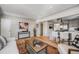 Spacious open-concept living and kitchen area with hardwood floors and stylish contemporary design at 4745 S Sherman St, Englewood, CO 80113