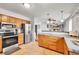 Kitchen featuring stainless steel appliances and light wood cabinets at 352 Indiana Ave, Berthoud, CO 80513