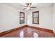 Well-lit bedroom with hardwood floors and ceiling fan at 4860 Stuart St, Denver, CO 80212