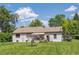 View of the back of the house and expansive backyard at 675 Holland St, Lakewood, CO 80215