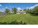 Large backyard showcasing the home's exterior and expansive green space at 675 Holland St, Lakewood, CO 80215