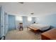 Spacious bedroom with large windows, carpet flooring, and ample natural light at 675 Holland St, Lakewood, CO 80215