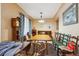 Dining room with natural light, neutral walls and floors, and a dark wood dining table at 675 Holland St, Lakewood, CO 80215