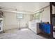 Laundry room featuring a washer, dryer, and water heater at 675 Holland St, Lakewood, CO 80215