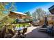 Inviting back deck offers ample seating and a shaded dining area, perfect for outdoor entertaining at 7083 Leopard Dr, Lone Tree, CO 80124