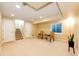 Spacious basement area with neutral carpeting, recessed lighting, and a comfortable seating arrangement at 7083 Leopard Dr, Lone Tree, CO 80124