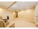 Expansive basement area with carpet flooring and two chairs at 7083 Leopard Dr, Lone Tree, CO 80124