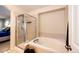 This bathroom has a glass shower next to a large tub at 7083 Leopard Dr, Lone Tree, CO 80124