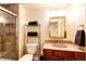 This bathroom features a standing shower with glass door at 7083 Leopard Dr, Lone Tree, CO 80124