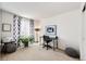 Bright home office space featuring a desk, chair, and a large window with patterned curtains at 7083 Leopard Dr, Lone Tree, CO 80124