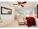 Bright living room with neutral carpet, vaulted ceiling, and lots of natural light at 7083 Leopard Dr, Lone Tree, CO 80124