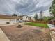 Spacious backyard with a fire pit, green lawn, patio seating, and privacy fencing at 380 S 25Th Ave, Brighton, CO 80601