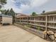 Backyard with a storage shed, concrete area, and wooden planter boxes along the fence at 380 S 25Th Ave, Brighton, CO 80601