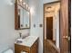 Bright bathroom with vanity and medicine cabinet, and framed mirror at 380 S 25Th Ave, Brighton, CO 80601