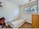 Bedroom with a bed, window, and neutral colored walls at 380 S 25Th Ave, Brighton, CO 80601