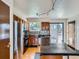 Bright kitchen featuring stainless steel appliances, a black countertop island, hardwood floors, and a window view at 380 S 25Th Ave, Brighton, CO 80601