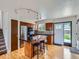 Well-equipped kitchen with a central island, stainless steel appliances, hardwood floors, and ample cabinet space at 380 S 25Th Ave, Brighton, CO 80601