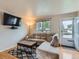 Well-lit living room with a plush sofa, hardwood floors, a modern TV and an inviting atmosphere at 380 S 25Th Ave, Brighton, CO 80601