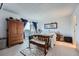 Cozy bedroom features neutral carpet, a balcony, and classic wood furniture for added charm at 1313 Steele St # 606, Denver, CO 80206