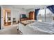 Bright bedroom with a sliding glass door to the balcony and a glimpse of the city skyline at 1313 Steele St # 606, Denver, CO 80206