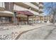 Holland House condo building with brick facade, covered entry, and landscaping features at 1313 Steele St # 606, Denver, CO 80206