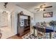 Cozy dining area with hardwood floors, ceiling fan, and view to the hallway at 1313 Steele St # 606, Denver, CO 80206