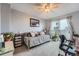 Welcoming living space featuring a cozy daybed, soft lighting, and balcony access with cityscape views at 1313 Steele St # 606, Denver, CO 80206