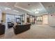 Cozy condo lobby featuring striped wall paper, seating, and large windows at 1313 Steele St # 606, Denver, CO 80206