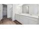 Modern bathroom with double vanity, elegant mirrors and fixtures, offering convenience and style at 9141 Telluride Ct, Commerce City, CO 80022