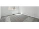 Bedroom showcasing neutral carpet, bright white walls, and a window with natural light at 9141 Telluride Ct, Commerce City, CO 80022