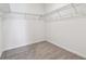 Walk-in closet featuring ample shelving for storage, providing organization and convenience at 9141 Telluride Ct, Commerce City, CO 80022