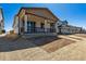 Inviting home with a covered porch and manicured lawn, creating an attractive curb appeal at 9141 Telluride Ct, Commerce City, CO 80022