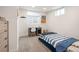 Bedroom with neutral paint, carpeted floor, and a large window for natural light at 7270 S Jay St, Littleton, CO 80128