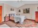 Cozy bedroom featuring plush carpet, colorful rug, and a bright window view at 30813 Kings Valley Dr, Conifer, CO 80433